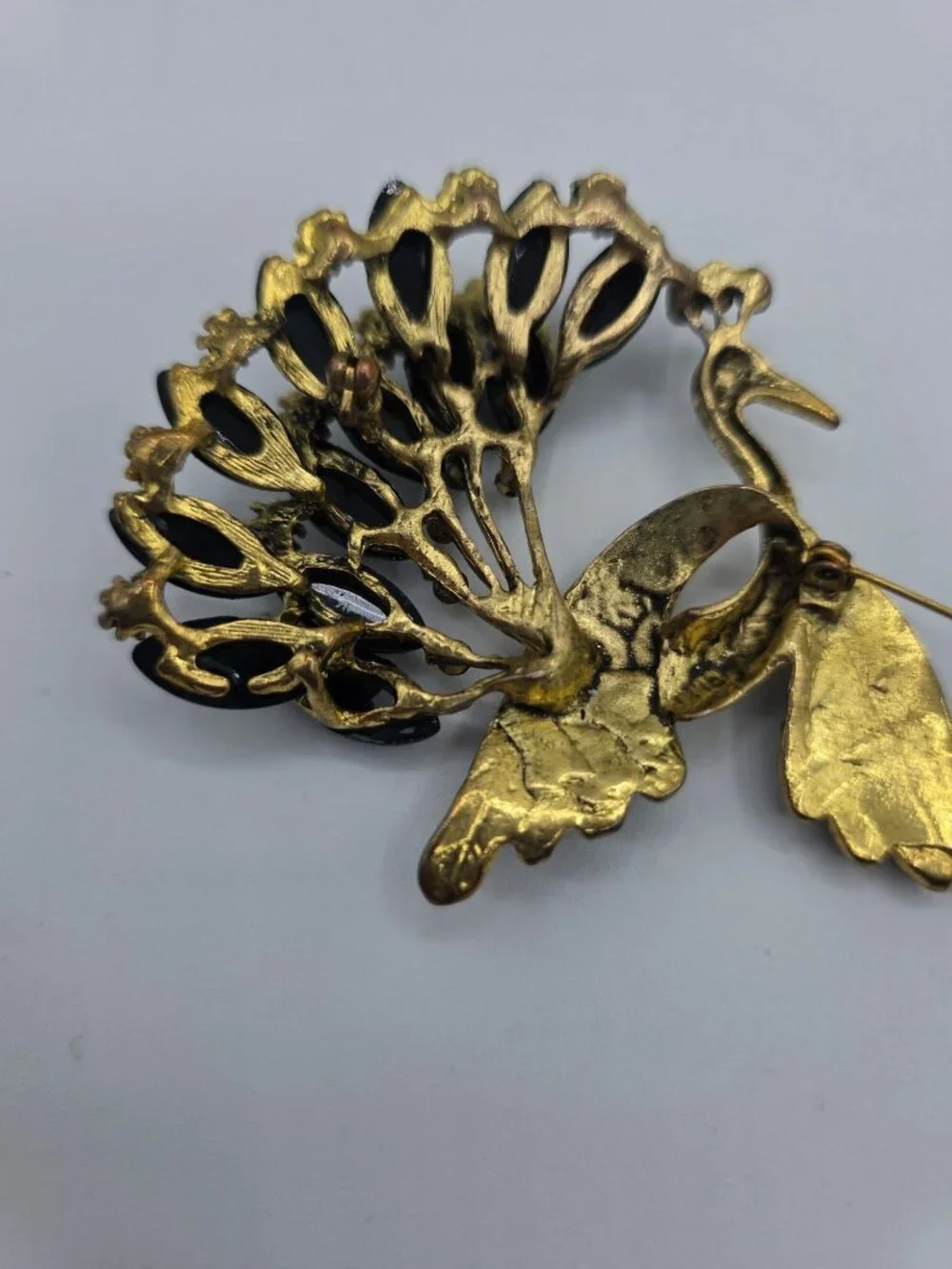 Gold-Tone Peacock Brooch With Rhinestone Wings & Black Gemstone Tail Feathers